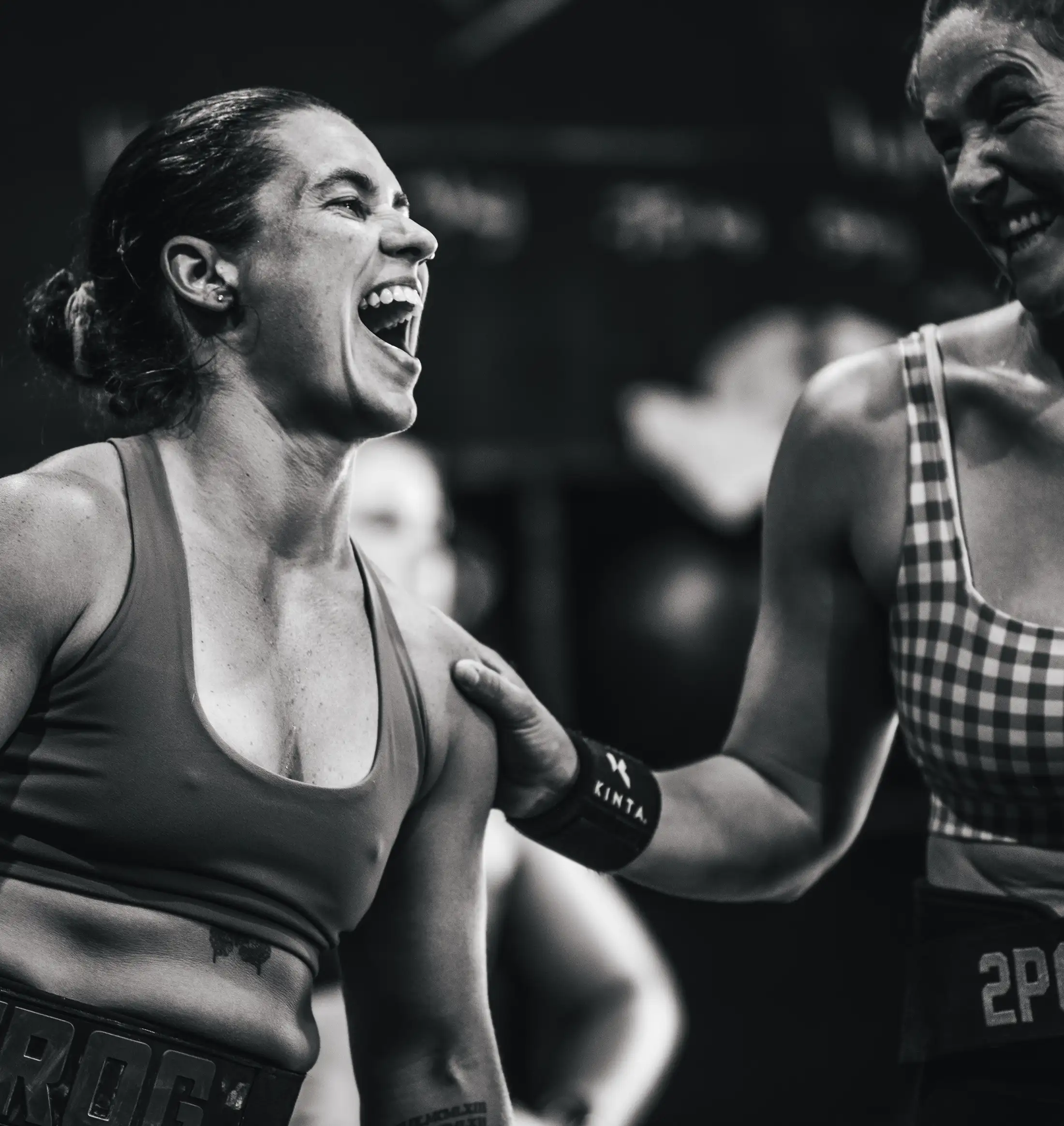 A coach guiding a member through a movement at CrossFit Ulladulla